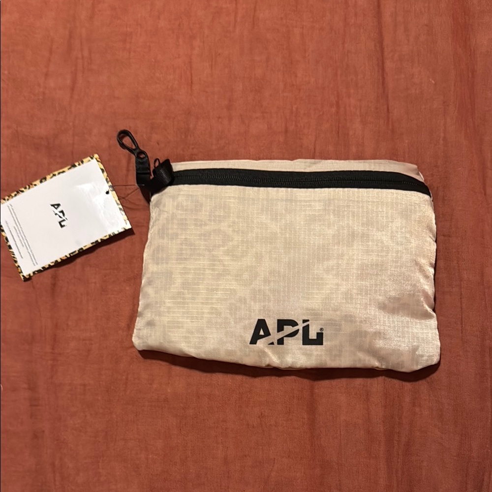 APL Light Tan Pouch converts to backpack for travel